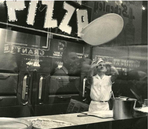 newyorkthegoldenage:  Pizzas were introduced to the U.S. in New York. Here, in 1948, Arthur Grumbine flips dough in the air in a pizza shop on 42nd Street Times Square near 7th Avenue (detail).N.Y. Historical Society Instagram