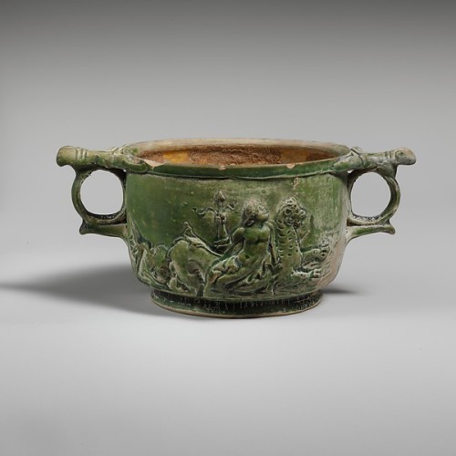 ancientpeoples:Terracotta lead-glazed scyphus (drinking cup) It is decorated with reliefs of a satyr