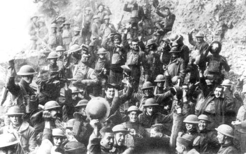 American soldiers of the 64th regiment, part of the 7th division, celebrate the signing of the armis