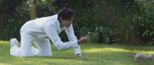 relativegarnet:  Adrien Brody attempts to photograph his pet Chihuahua