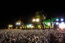 this looks like a sick concert until you realize it&rsquo;s a combine harvester in a cotton field