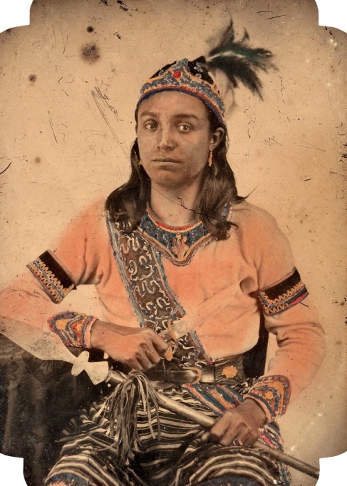 chubachus: Hand-colored ambrotype portrait of an Iroquois man posing with a knife and spear, c. 1855