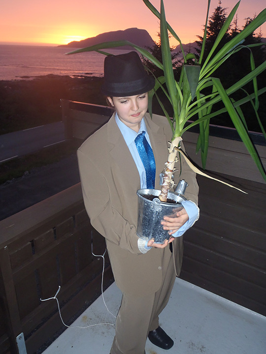 grumpsaesthetics:  grumpsaesthetics:  i only have a single picture in my apartment, and it’s a picture of me when i was 15 years old, standing on a balcony with the sun setting behind me, wearing my mom’s ex-boyfriends suit (that’s 5 sizes too