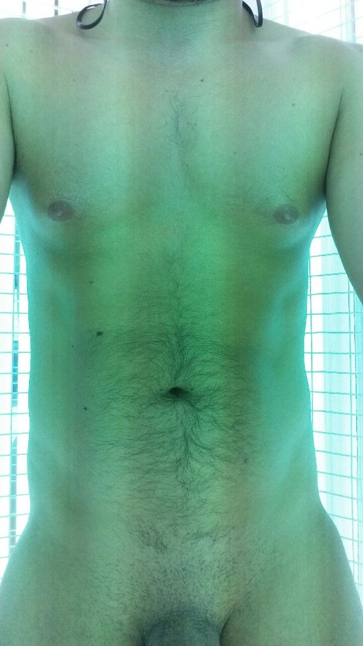 Showing off in the tanning booth at the gym.