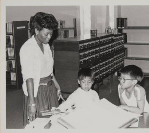 vintagelibraries:  Library staff helping adult photos