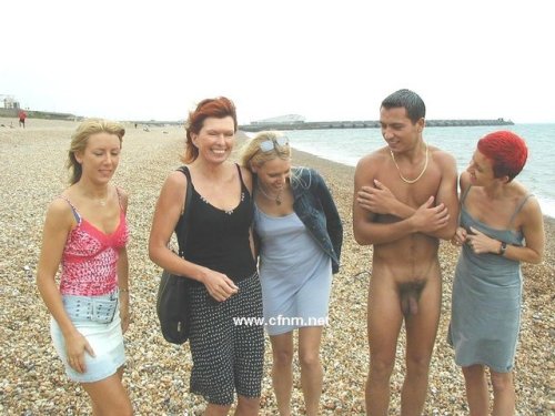 on the beach with his girlfriend her mother and her two aunts