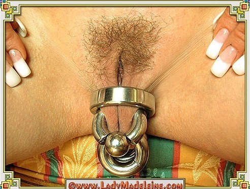 pussymodsgalore:  pussymodsgalore   Unusual and interesting. Pierced outer labia pulled through a ring (a cock ring?), and retained in that position by three (? difficult to see) heavy gauge rings inserted through presumably six stretched piercings.