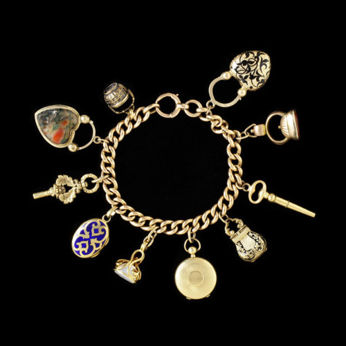 Charm bracelet, 1800-1900. Gold, enamel, hardstone, glass and photographs. V&AThese bracelets il