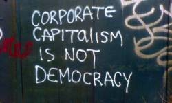 tranqualizer:  [photo: spray paint on a wall reads, “corporate capitalism is not democracy”] 