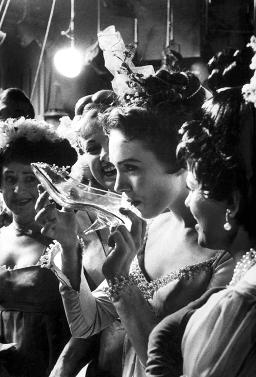 Julie Andrews / drinking champagne from her glass slipper during production of Rodgers and Hammerste