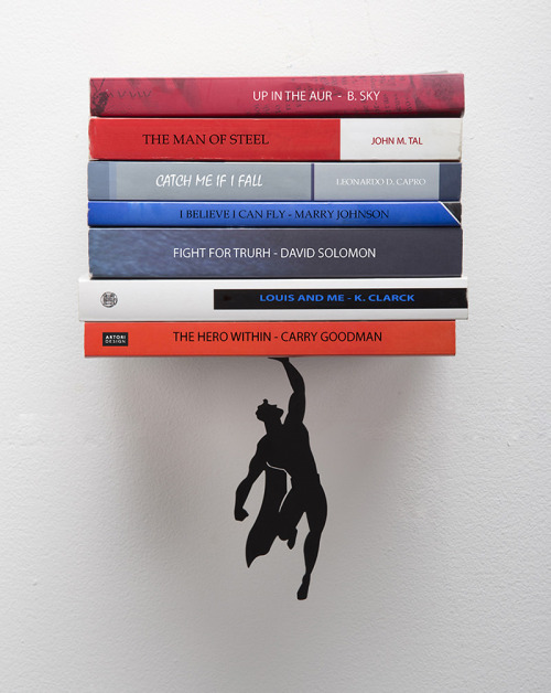 itscolossal:  Bookshelf Superheroes Appear to Save Your Favorite Reads