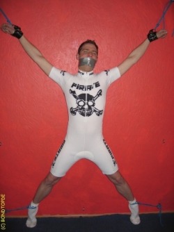 cgtwoface2:  gearjockmo:  Bicyclist forced to endure some torment.  He should be wearing a blindfold and earplugs at least. A Birdlocked Pico or Kali’s Teeth should keep that unsightly erection under control. Maybe a good chest and abs flogging would