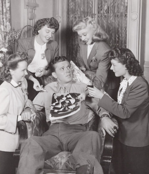 Ginger Rogers along with Kim Hunter, Mady Christians and Ruth Hussey fuss over G.I. Richard Martin i