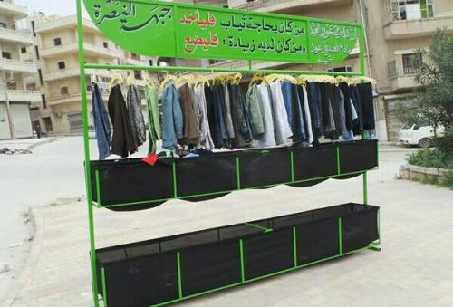 reem33:  Those who need clothes, take.Those who want to donate, give.Jabhat Al-Nusra social activities in War effected Syria.  .