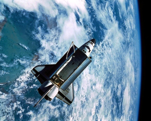 Space Shuttle Discovery, as seen by the IMAX camera on the SPAS-ORFEUS satellite during STS-51.