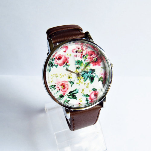 wickedclothes:  Floral Vintage Style Watch Crafted entirely by hand, this vintage style watch features a floral patterned face. A great accessory for spring time. Leather watch band is fully adjustable in size. Sold on Etsy.