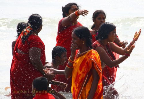 Pilgrims from Kerala playing in the sea in Mahabalipuram.