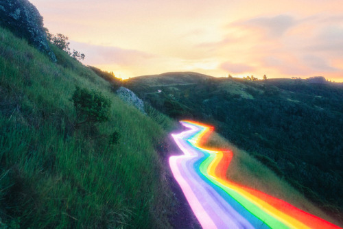 itscolossal:Vivid Rainbow Roads Trace Illuminated Pathways Across Forests and Beaches