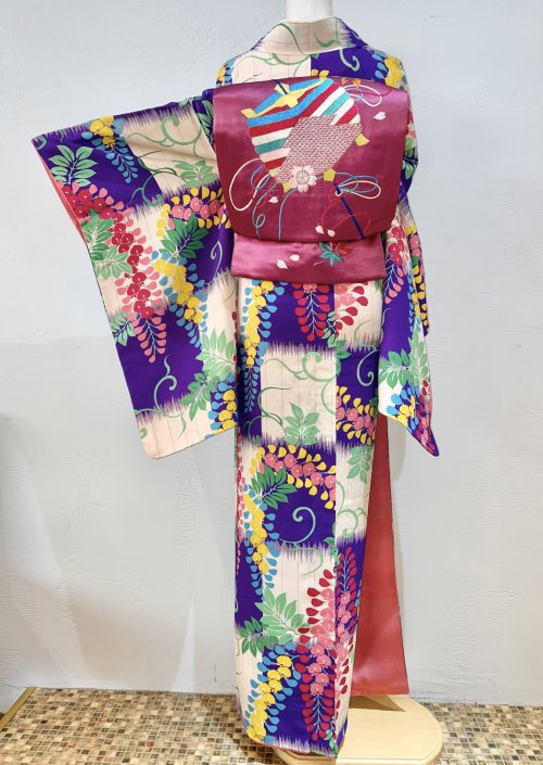 Joyful seasonal antique outfit, featuring a colorful fuji (wisteria) over ichimatsu (checks) kimono,