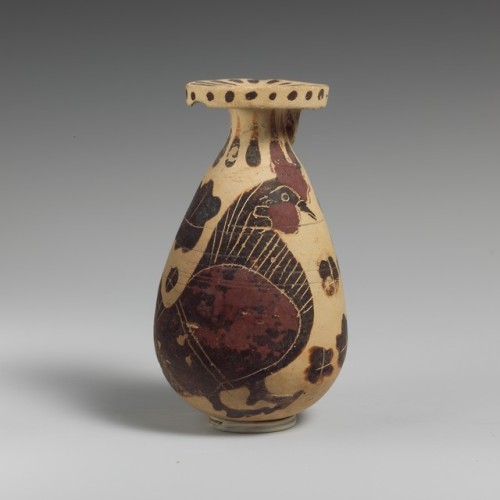 Corinthian terracotta alabastron (perfume vase) depicting a rooster in a field of rosettes.  Artist 