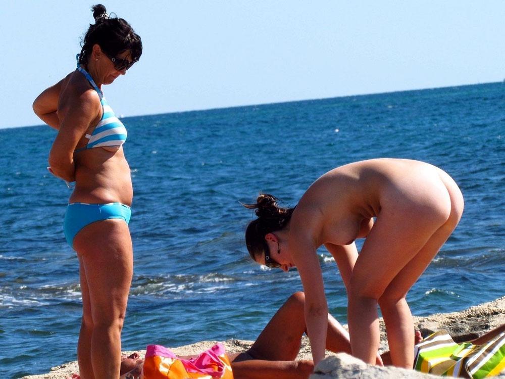 real-naturist-beach:  Mother and daughter undressing on a nude beach