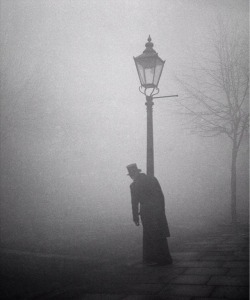 furtho: Bill Brandt’s photograph of a drunk man in top hat and tails clinging to a lamppost in the early morning smog, London, 1934 (via here)