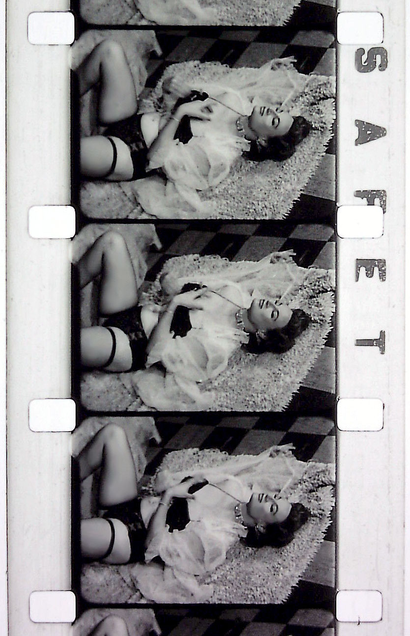 Cherrie Knight is featured in frames from an 8mm Burlesque short, entitled:  “SAILOR’S