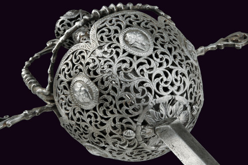 art-of-swords:  Cup-hilt Rapier Dated: 19th Century (made in 17th century style) Culture: Italian Measurements: overall length 132 cm The sword has a straight blade of lozenge section, small tang and a flat ricasso. The iron hilt comes in the shape of