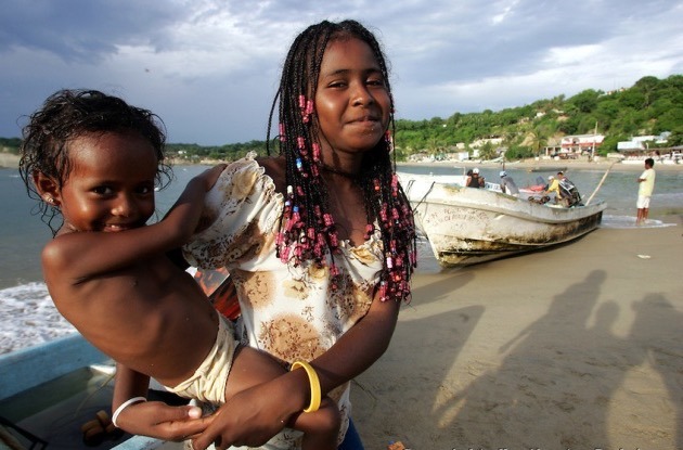 atomickong: Afro-Mexican woman holding her daughter at La Coasta Chica in Oaxaca,