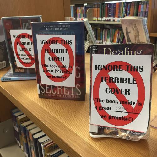 thessalian: bookavore: Quite possibly my favorite book display of all time Not all heroes wear capes