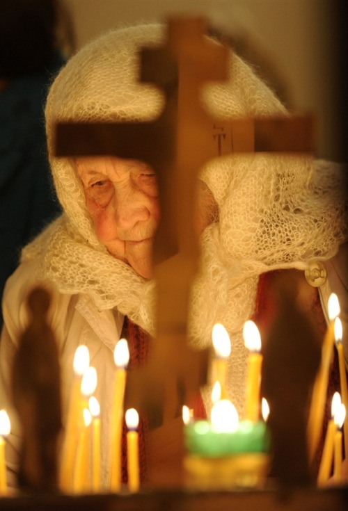 globalchristendom:A woman at an Orthodox Christmas service at Vladimir Ravnoapostolny Cathedral in S