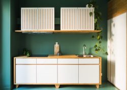 dezeen:  Paris apartment updated with slender white staircase and dark green kitchen ›