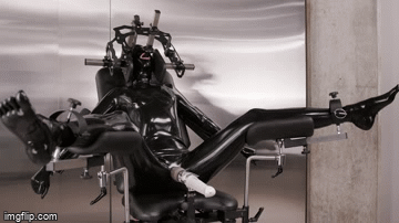 latexdroned:  Life of A Drone:A subject enters the last phase of the transformation process, tended by a corporate drone. Physical changes have been applied, mental conditioning embedded within its pliant mind; all that remains is to trigger the final