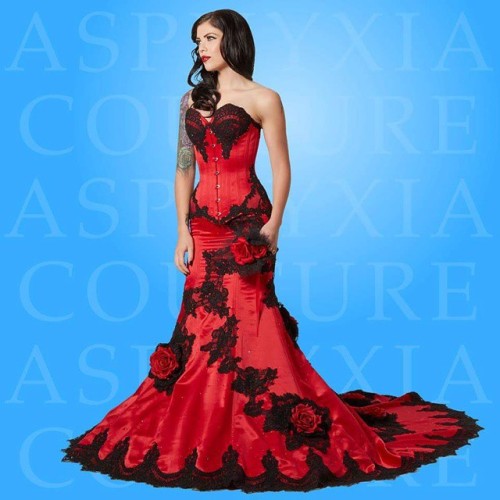 Red delustered satin and black alencon lace bridal corsetted gown. For all orders & enquiries, p
