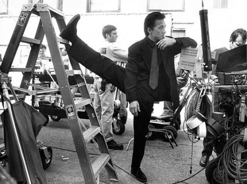 guts-and-uppercuts:Jackie Chan stretching between scenes on the set of “Rush Hour”.