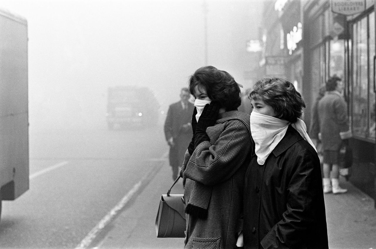 Daily Herald/Mirrorpix/Getty Images. Women covering their faces during a fog bound London, England, 5th December 1962.
