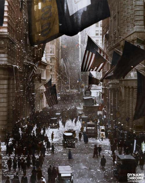 Wall Street on November 7, 1918. New Yorkers are celebrating after hearing a rumor that an armistice