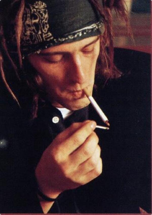 Izzy Stradlin smoking a cigarette (or weed)
