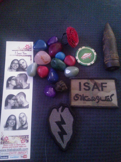 Some of my favorite things from my box of memories. I forgot I had all this stuff :’) My husband’s “I suck at fighting” patch. 25mm shell from a Bradley My old lucky casino chip Those pebbles are from Chena Hot Springs in Alaska