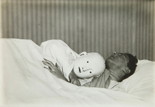 mysong5:jean cocteau with his mask of antigone