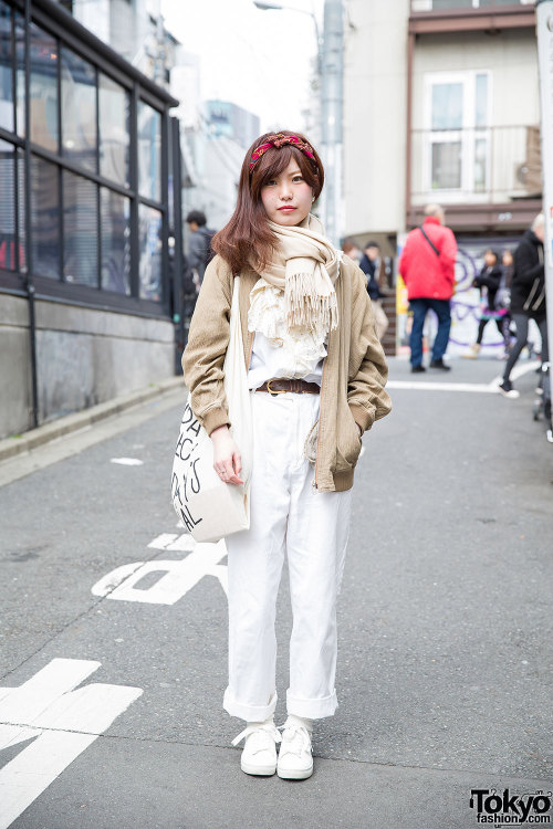 Conomi on the street in Harajuku wearing a resale jacket with Tomorrowland pants, H&M canvas sne