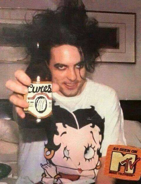 Robert Smith in a Betty Boop shirt reblog if you agree.