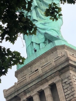 the-parental-advice:  c4tbus:Today, Therese Patricia Okoumou, a Congolese immigrant, scaled the Statue of Liberty and said she would not be moved until all the children detained from ICE were released.  Now this is a hero. 