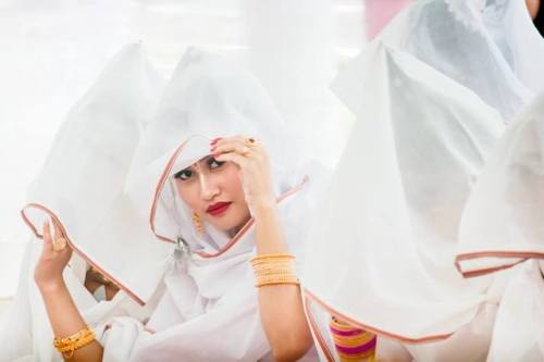 Hidden faces, Beautiful veiled woman protecting themselves from the colored powders, Holi Festival a