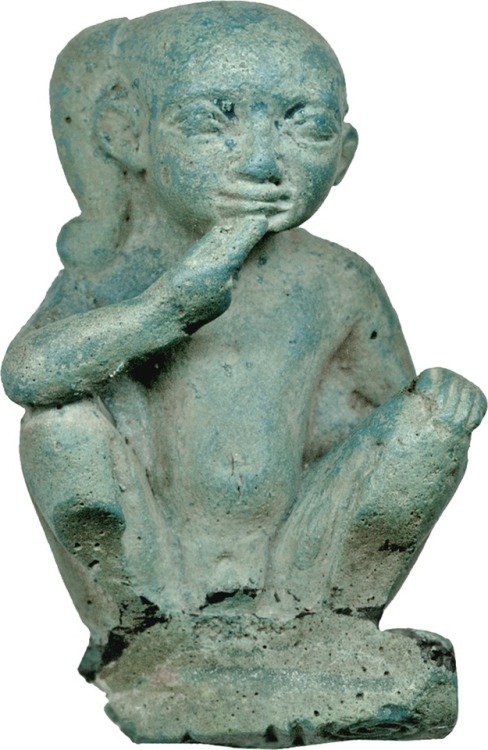 Ancient Egyptian faience miniature depicting the god Horus as a squatting child; perhaps used as a s