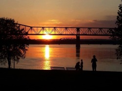 ms-woodsworld:  Louisville, Kentucky’s Waterfront Park and the Ohio River bridges at sunset. Photo by Tascha Sodan