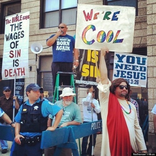 saevuswinds:  thegailygrind:  Cool Jesus at Chicago pride  I’m still laughing at that police officer he’s all like, “God bless you go Jesus” 