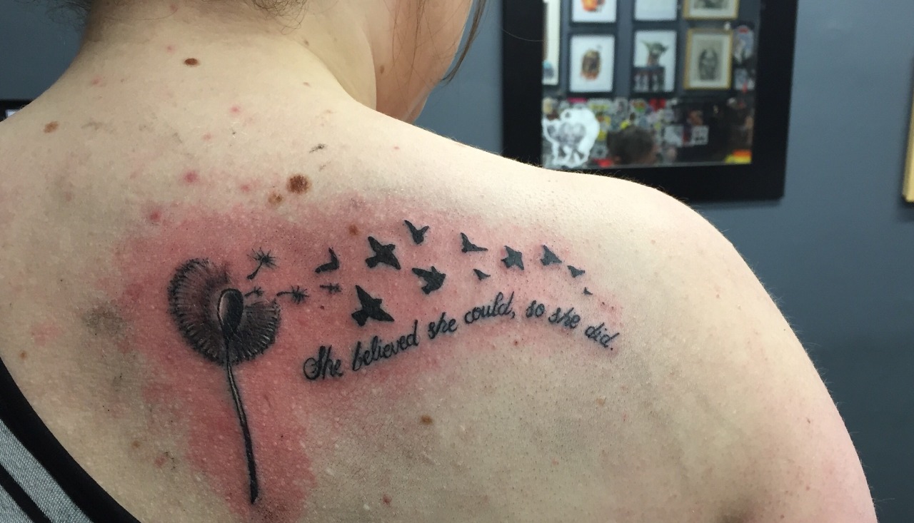 She believed she could so she did spine tattoo