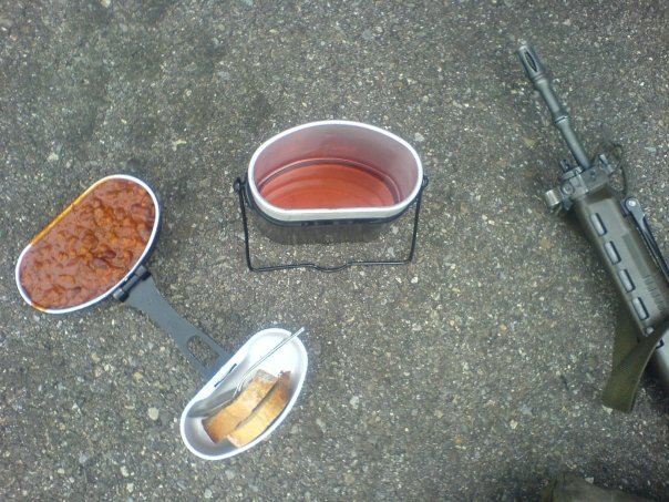 Ladies and gentlemen: our very first soldier sad desk lunch. Or sad gravel while doing whatever with a gigantic gun lunch.