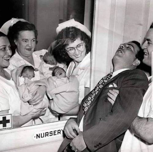 blessedimagesblog:  Nurses show triplets to the father who passes out with excitement. Photo from 1946, when ultrasound did not exist